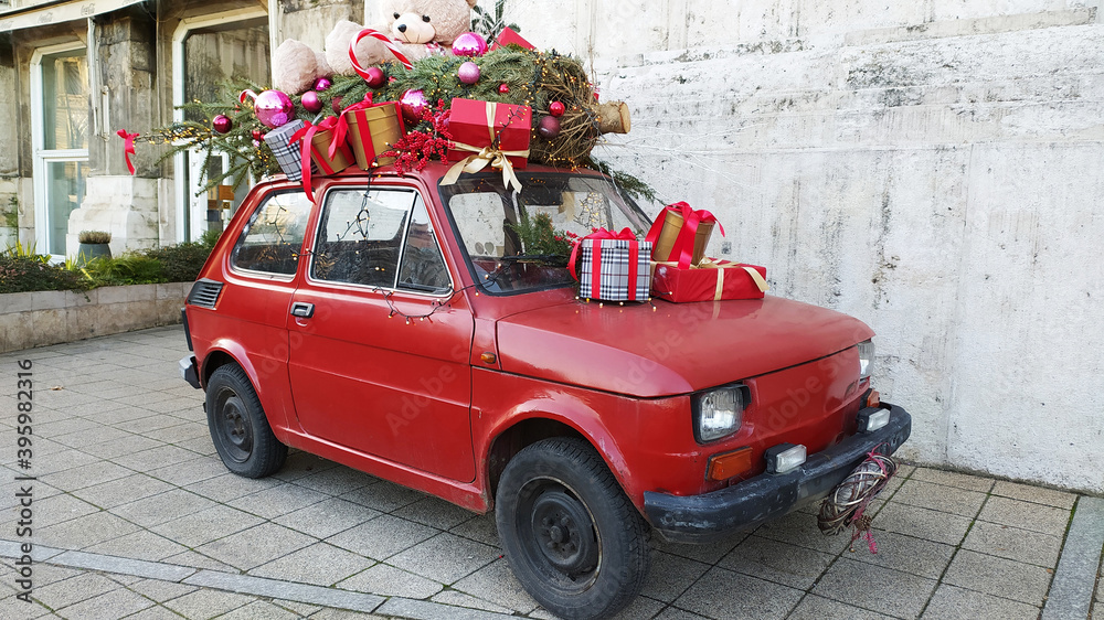 Merry Christmas and Happy New Year mood by a retro red car