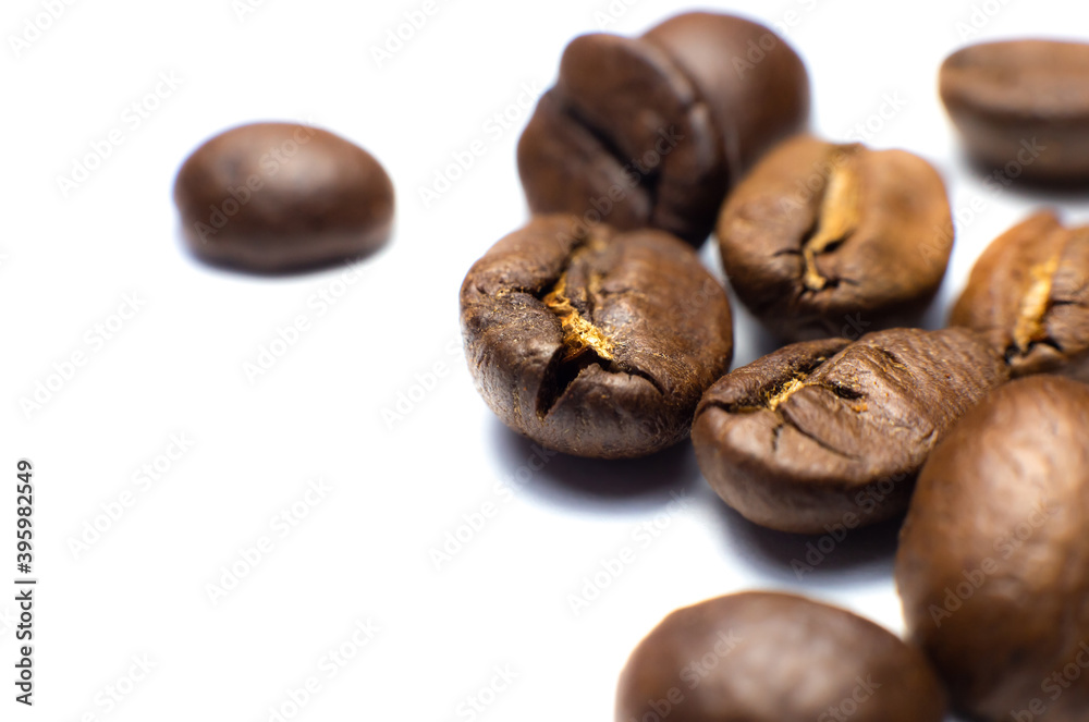 Coffee beans on white background. Close up photo. Coffee beans on white background. Close up photo.