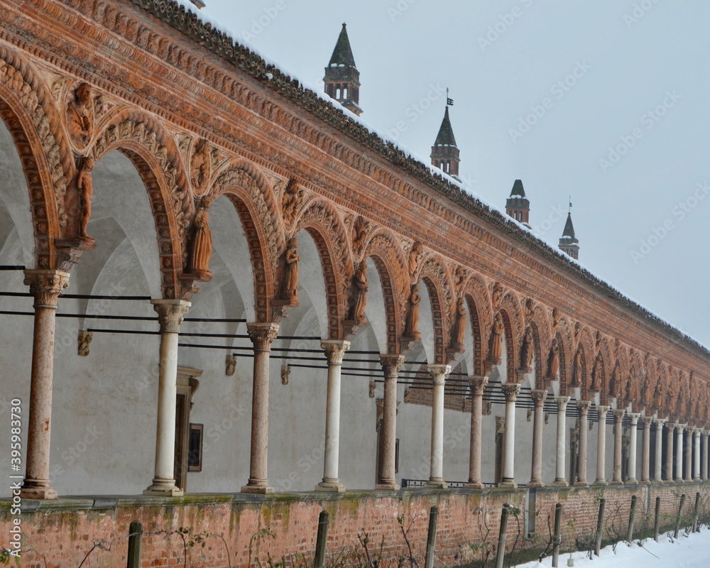 Archery with Renaissance sculptural decoration of the great cloister of cartosa di Pavia. Italy