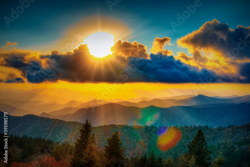 A sunset of the Blue Ridge Parkway in Autumn with sunlight and lensglare in North Carolina in HDR.