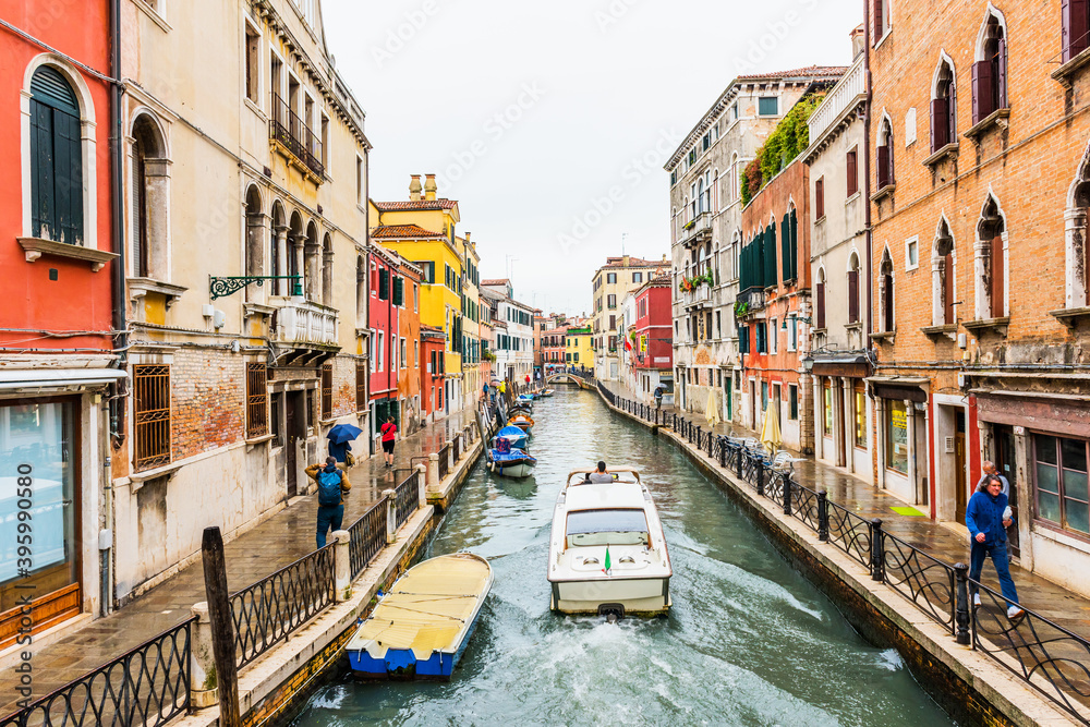 Venice canal and traditional colorful Venetian houses view. Venice, Italy.