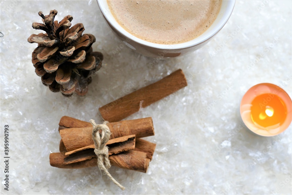 Coffee with cinnamon and winter background Coffee with cinnamon and winter background