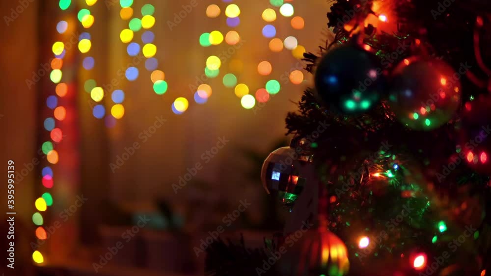 Decorated Christmas tree with flashing lights at home Decorated Christmas tree with flashing lights at home