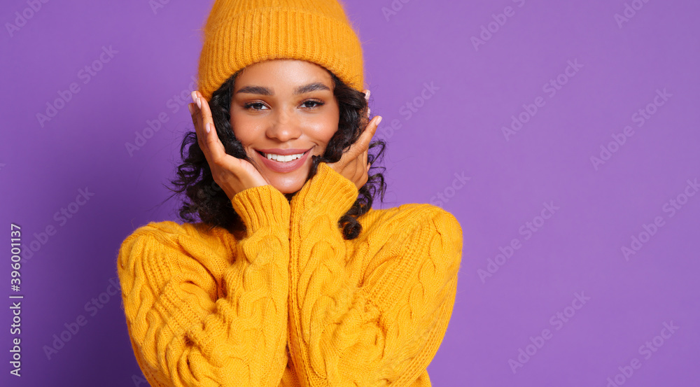 Ethnic female smiling and touches her cheeks with her hands. Ethnic female smiling and touches her cheeks with her hands.