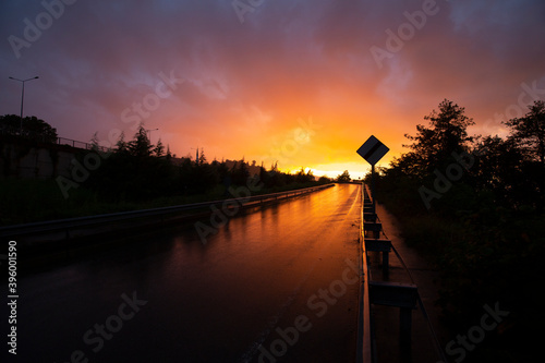 wet reflected road in sunset