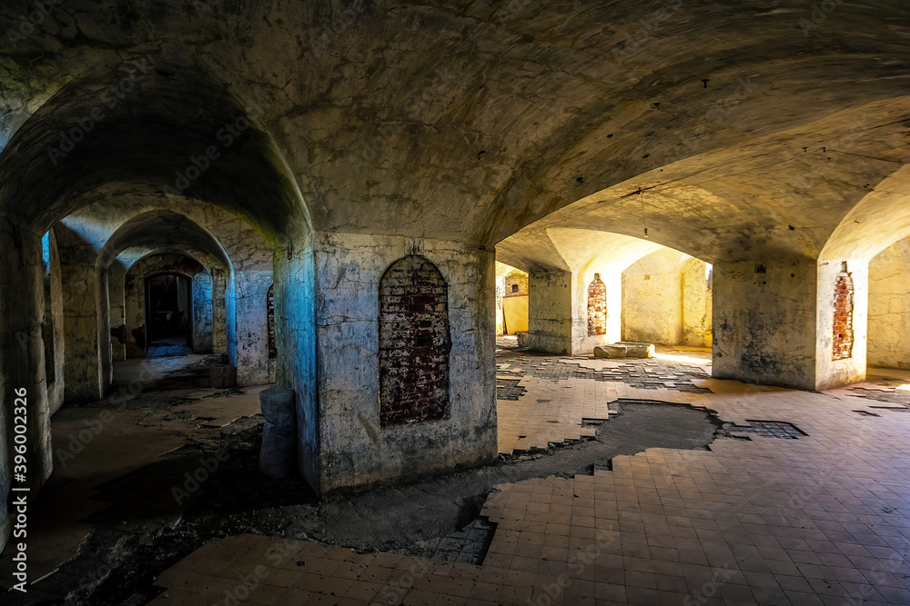 Fototapeta premium Dark and creepy vaulted abandoned dungeon under church