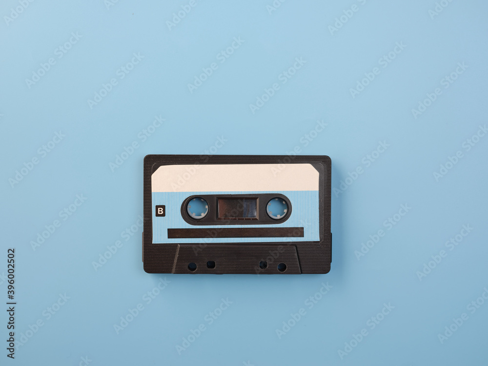 Blue audio cassette on blue background