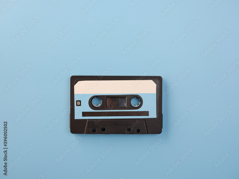 Fototapeta premium Blue audio cassette on blue background