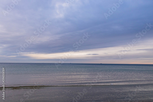 Fototapeta Naklejka Na Ścianę i Meble -  
beautiful calm sea waving in the early morning on a golden sandy beach