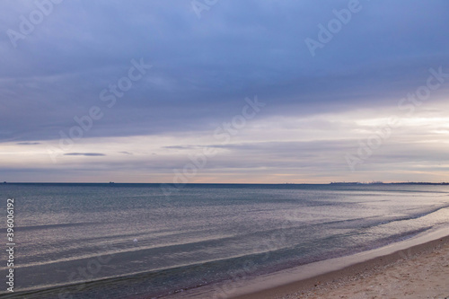  beautiful calm sea waving in the early morning on a golden sandy beach