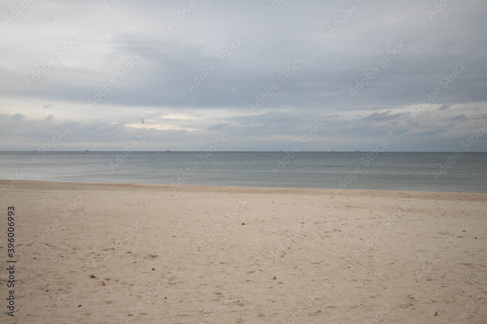 beautiful calm sea waving in the early morning on a golden sandy beach