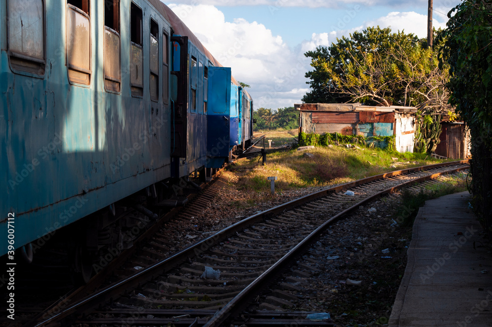 Blue wagons of an old train on the lines in a country town