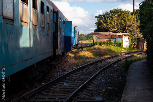 Blue wagons of an old train on the lines in a country town