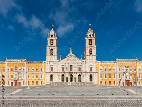 Main façade of the palace of Mafra, monumental Baroque and Neoclassical palace-monastery located in Mafra, Portugal.