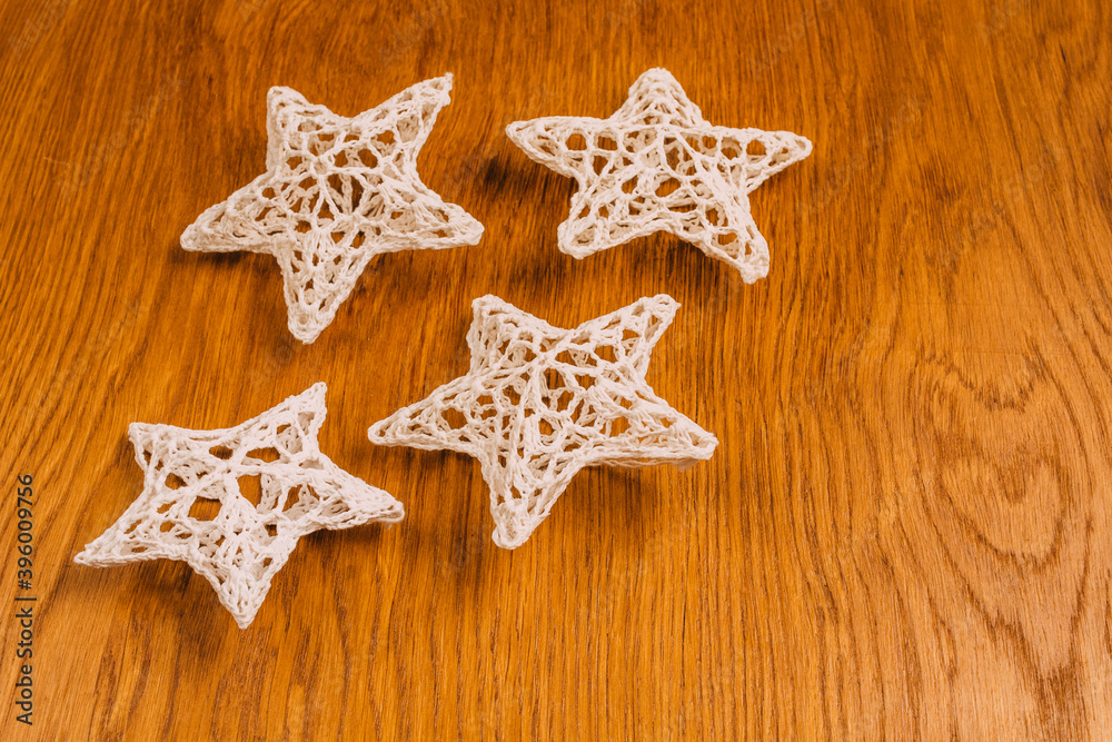 traditional crochet Christmas tree decorations, wooden background, christmas, flat lay