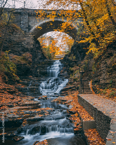 Waterfall in Cascadilla Gorge with autumn color, in Ithaca, New York photo