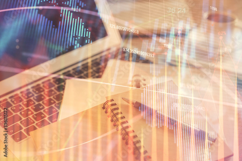 Double exposure of financial chart drawing and desktop with coffee and items on table background. Concept of forex market trading