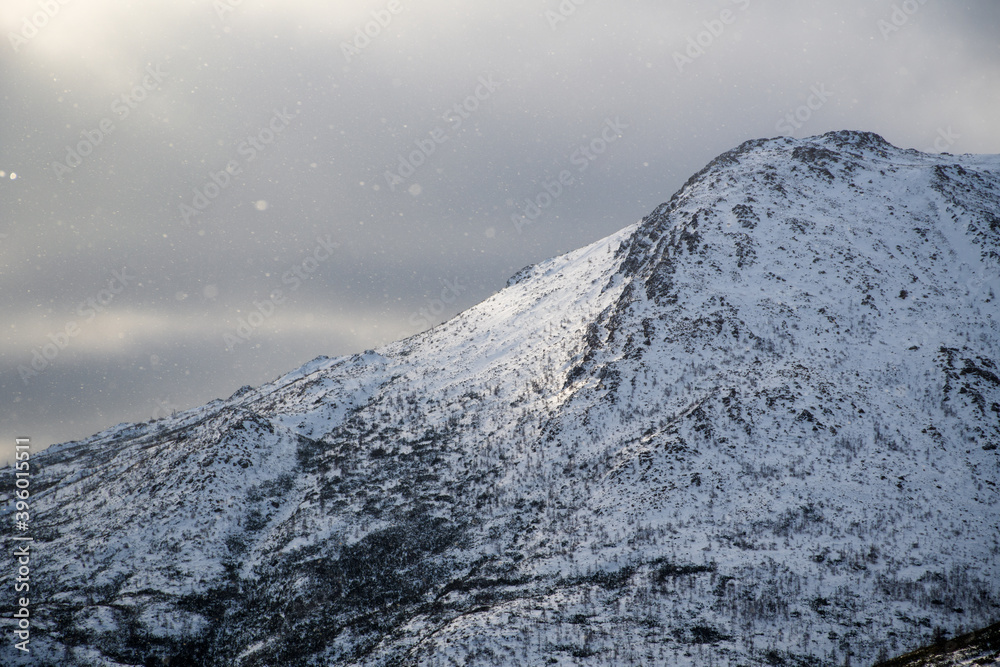 Close up on snowy summit of Mt Albert on a cold day as the sun pierces the sky of its golden light, Qc, Canada Close up on snowy summit of Mt Albert on a cold day as the sun pierces the sky of its golden light, Qc, Canada
