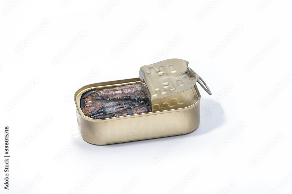 Closeup of an open can of sardines isolated on white background. Canned sardine. Closeup of an open can of sardines isolated on white background. Canned sardine.