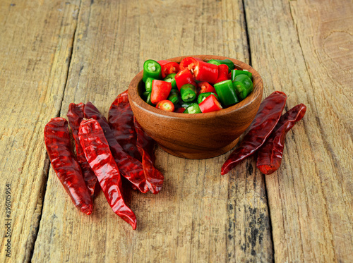 slice green hot chili  and drychili  on wood photo