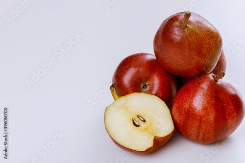 Organic fruit red shiny pears isolated on white background.