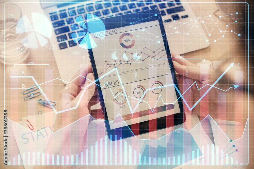 Double exposure of man's hands holding and using a digital device and forex graph drawing. Financial market concept. Double exposure of man's hands holding and using a digital device and forex graph drawing. Financial market concept.