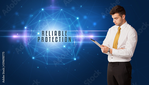 Businessman thinking about security solutions with RELIABLE PROTECTION inscription