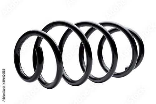 coil spring in black steel car suspension system spare parts, replacement part isolated on white background.