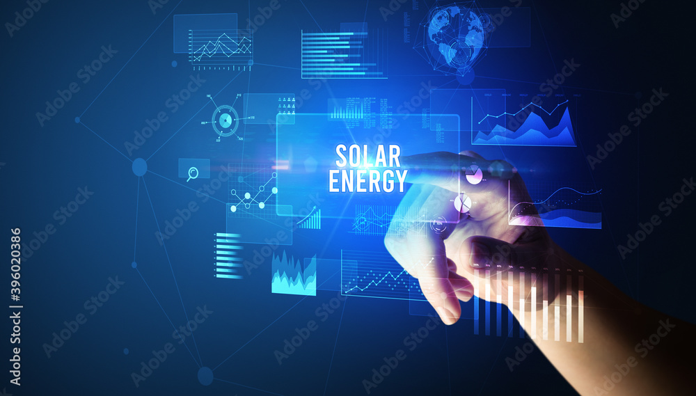 Hand touching SOLAR ENERGY inscription, new business technology concept Hand touching SOLAR ENERGY inscription, new business technology concept