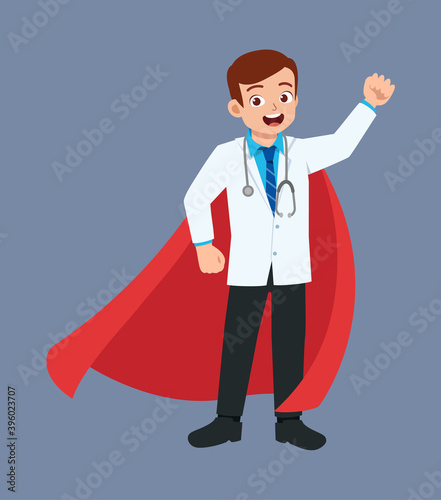 nice good looking young doctor standing and wearing a cape