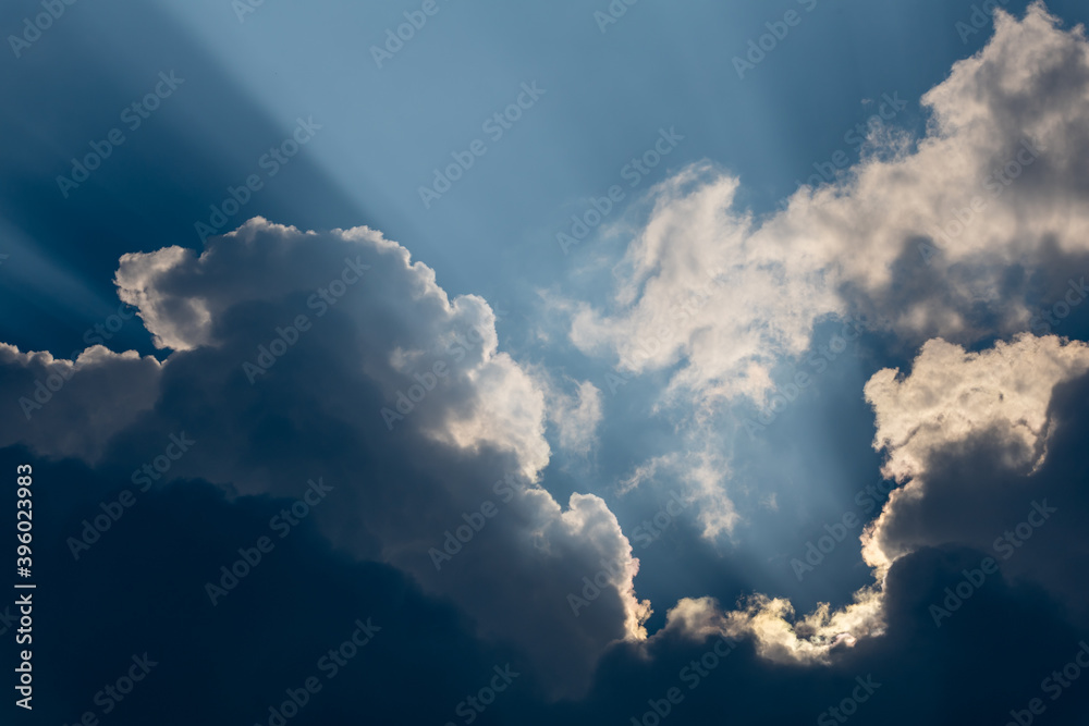 Sun beams breaking through the dark clouds Sun beams breaking through the dark clouds