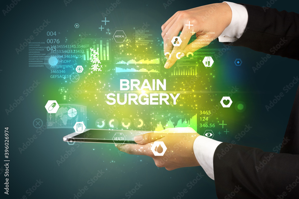 Close-up of a touchscreen with BRAIN SURGERY inscription, medical concept Close-up of a touchscreen with BRAIN SURGERY inscription, medical concept