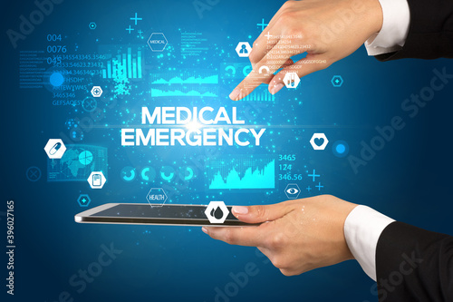 Close-up of a touchscreen with MEDICAL EMERGENCY inscription, medical concept