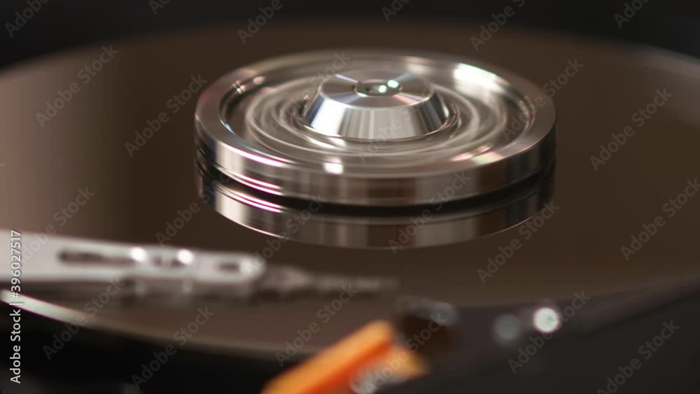 Working opened hard disk hdd drive close up macro Working opened hard disk hdd drive close up macro