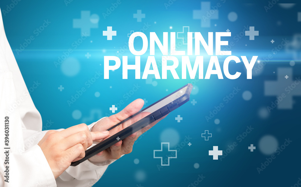 doctor writes notes on the clipboard with ONLINE PHARMACY inscription, first aid concept doctor writes notes on the clipboard with ONLINE PHARMACY inscription, first aid concept
