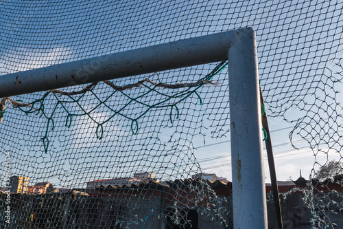 goal with broken net and abandoned