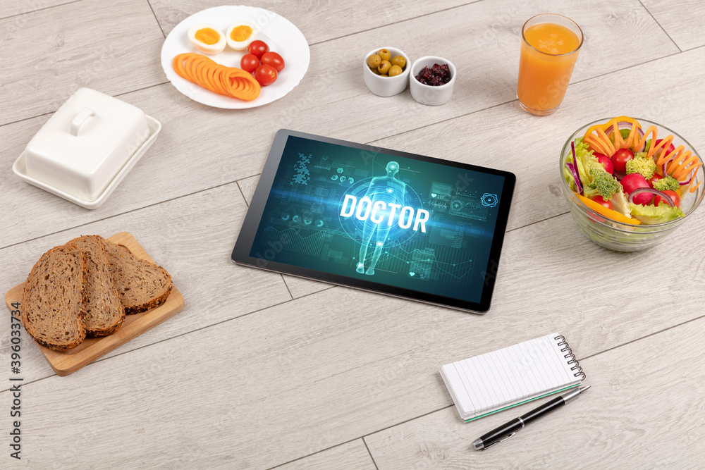 DOCTOR concept in tablet with fruits, top view DOCTOR concept in tablet with fruits, top view