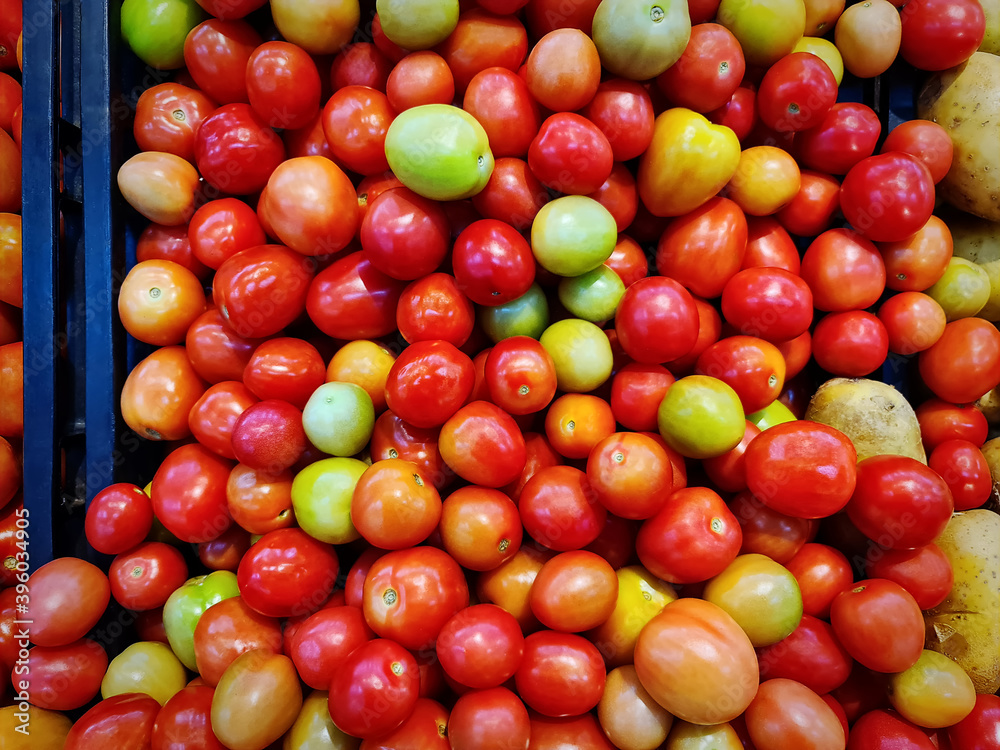 Pile of Red Small Tomatoes for Sale at Supermarket Pile of Red Small Tomatoes for Sale at Supermarket