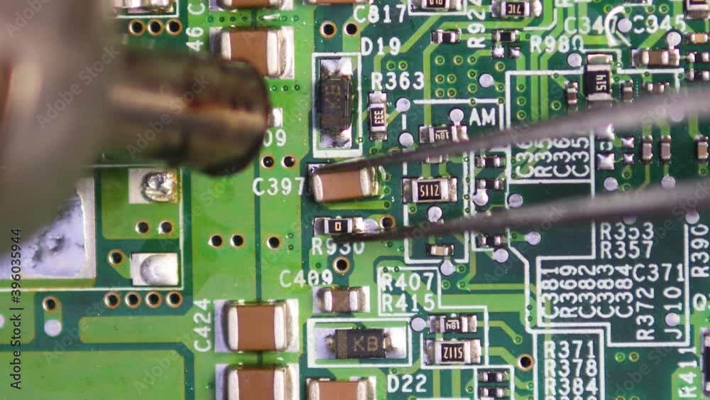 Desoldering smd with blower. Electronic repair close up macro 