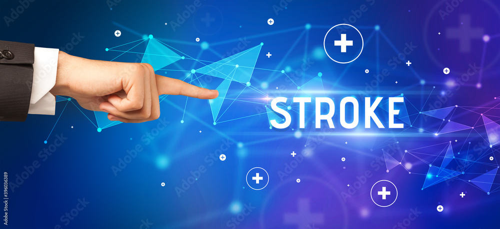 Close-Up of cropped hand pointing at STROKE inscription, medical concept Close-Up of cropped hand pointing at STROKE inscription, medical concept