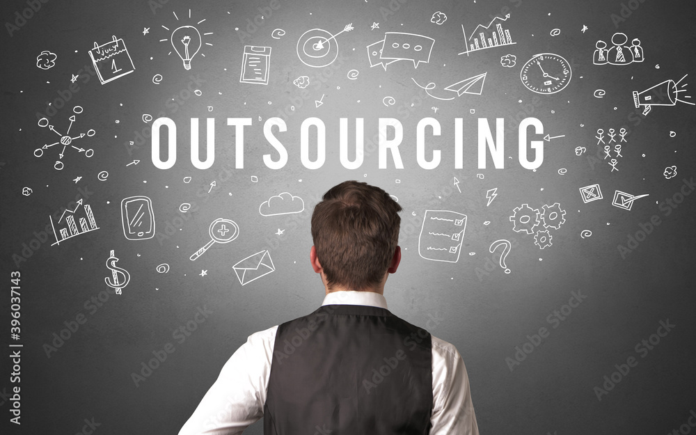 Rear view of a businessman with OUTSOURCING inscription, modern business concept