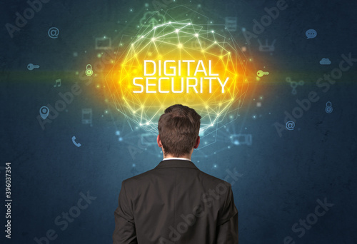 Rear view of a businessman with DIGITAL SECURITY inscription, online security concept