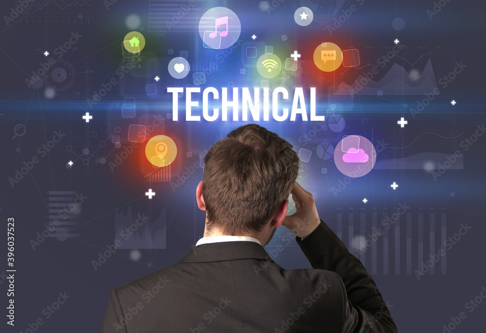 Rear view of a businessman with TECHNICAL inscription, modern technology concept Rear view of a businessman with TECHNICAL inscription, modern technology concept