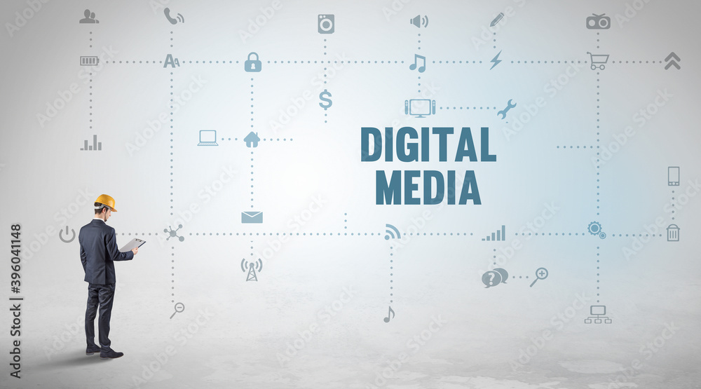 Engineer working on a new social media platform with DIGITAL MEDIA inscription concept Engineer working on a new social media platform with DIGITAL MEDIA inscription concept