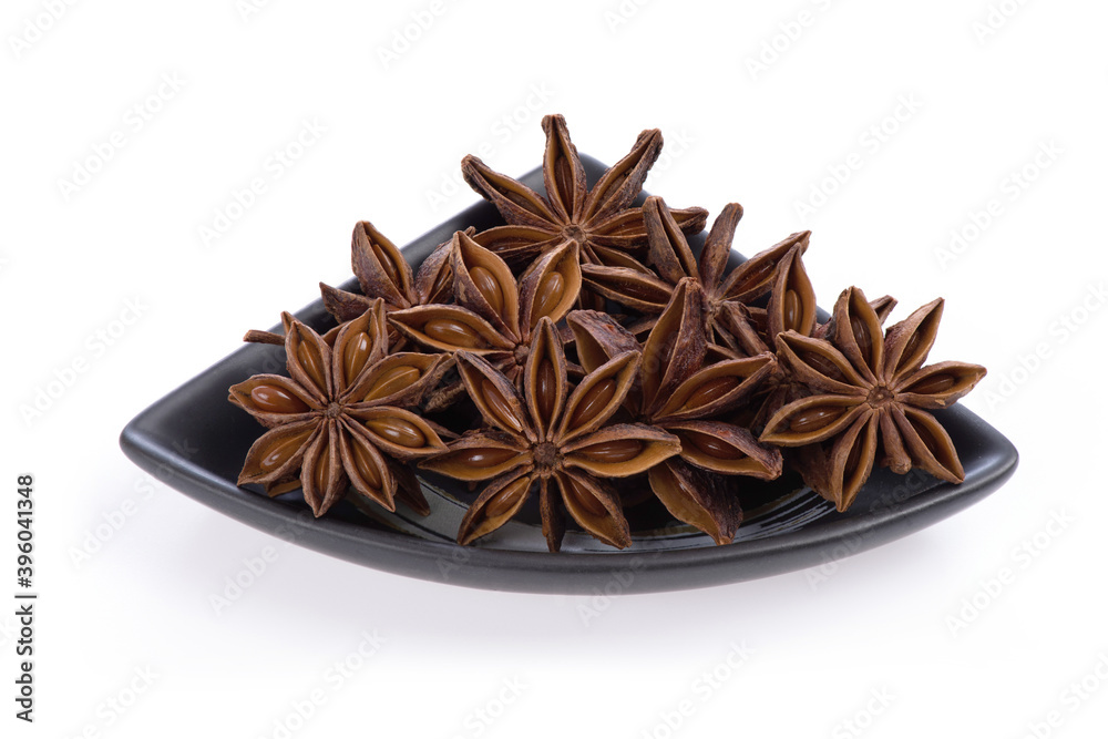 Chinese star anise fruits isolated on a white background. Chinese star anise fruits isolated on a white background.