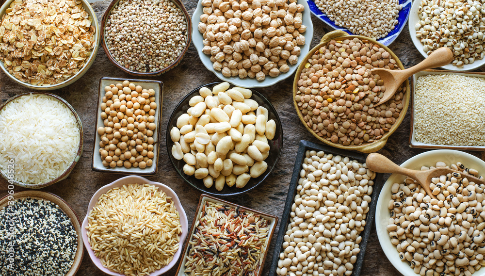 Variety kinds of dry organic white and brown cereal and grain seed on grunge background Variety kinds of dry organic white and brown cereal and grain seed on grunge background
