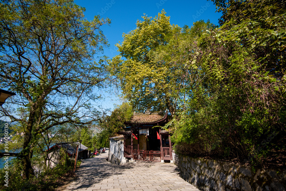 Obraz premium Street view local visitor and tourist in Furong Ancient Town (Furong Zhen, Hibiscus Town), China. Furong Ancient Town is famous tourism attraction place.