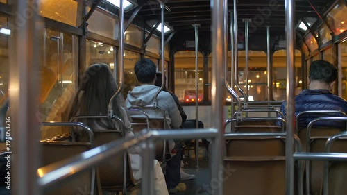 A shot from the back of passengers on a bus at night in Hong Kong China