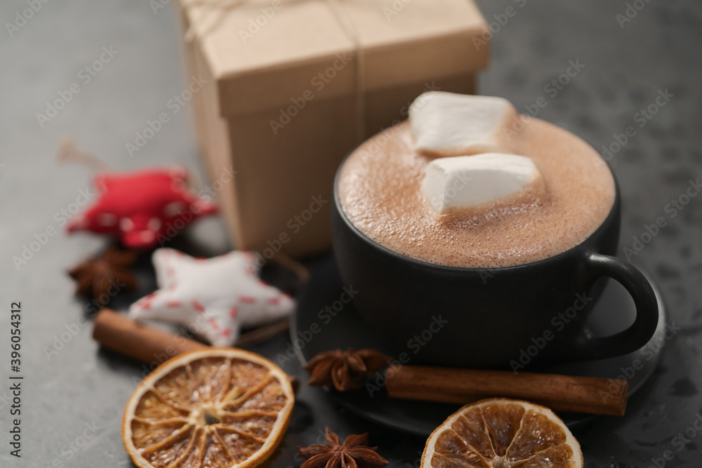 Hot chocolate in a black cup with christmas decorations Hot chocolate in a black cup with christmas decorations