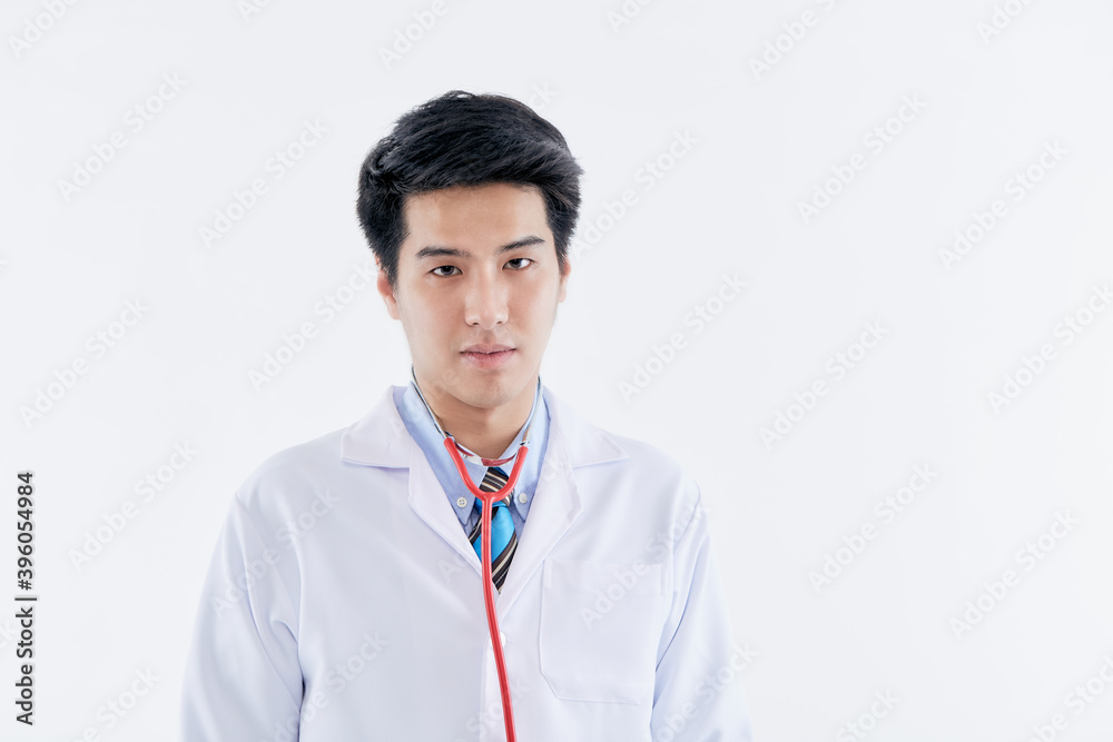 young man doctor posing with a stethoscope young man doctor posing with a stethoscope